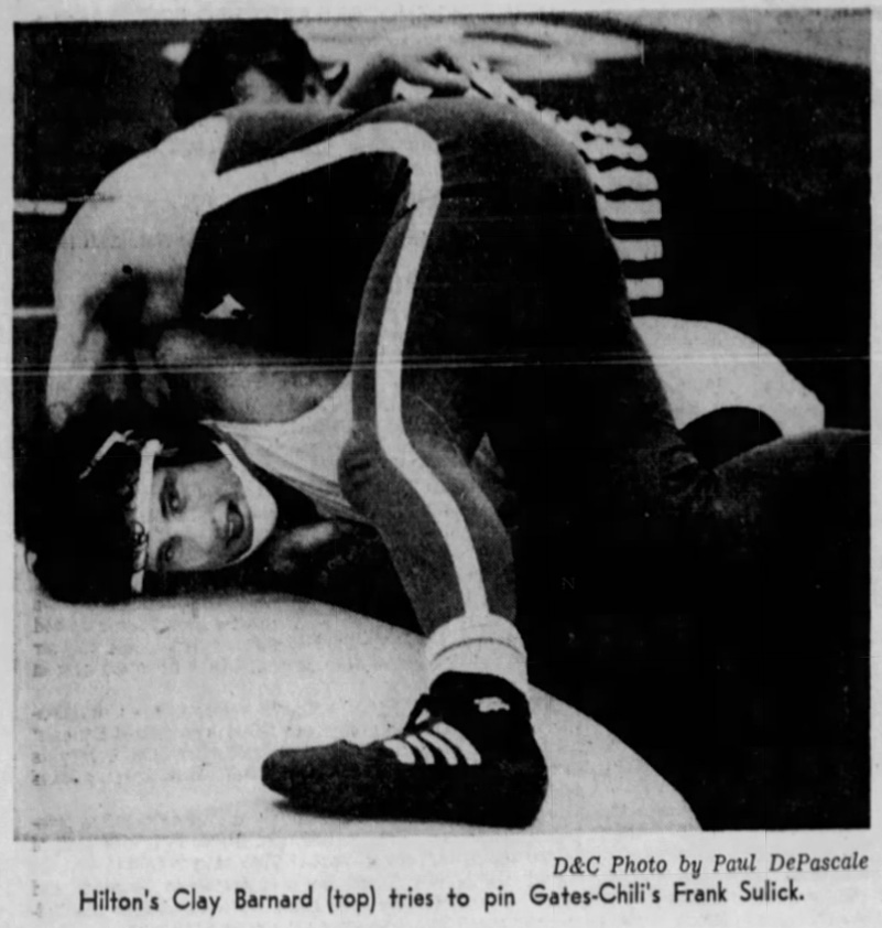 Hilton's Clay Barnard (top) tries to pin Gates Chili's Frank Sulick