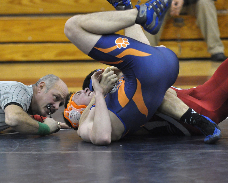 Hornell's Austin Dwyer sticks a pin as Referee Mike Fox makes the call